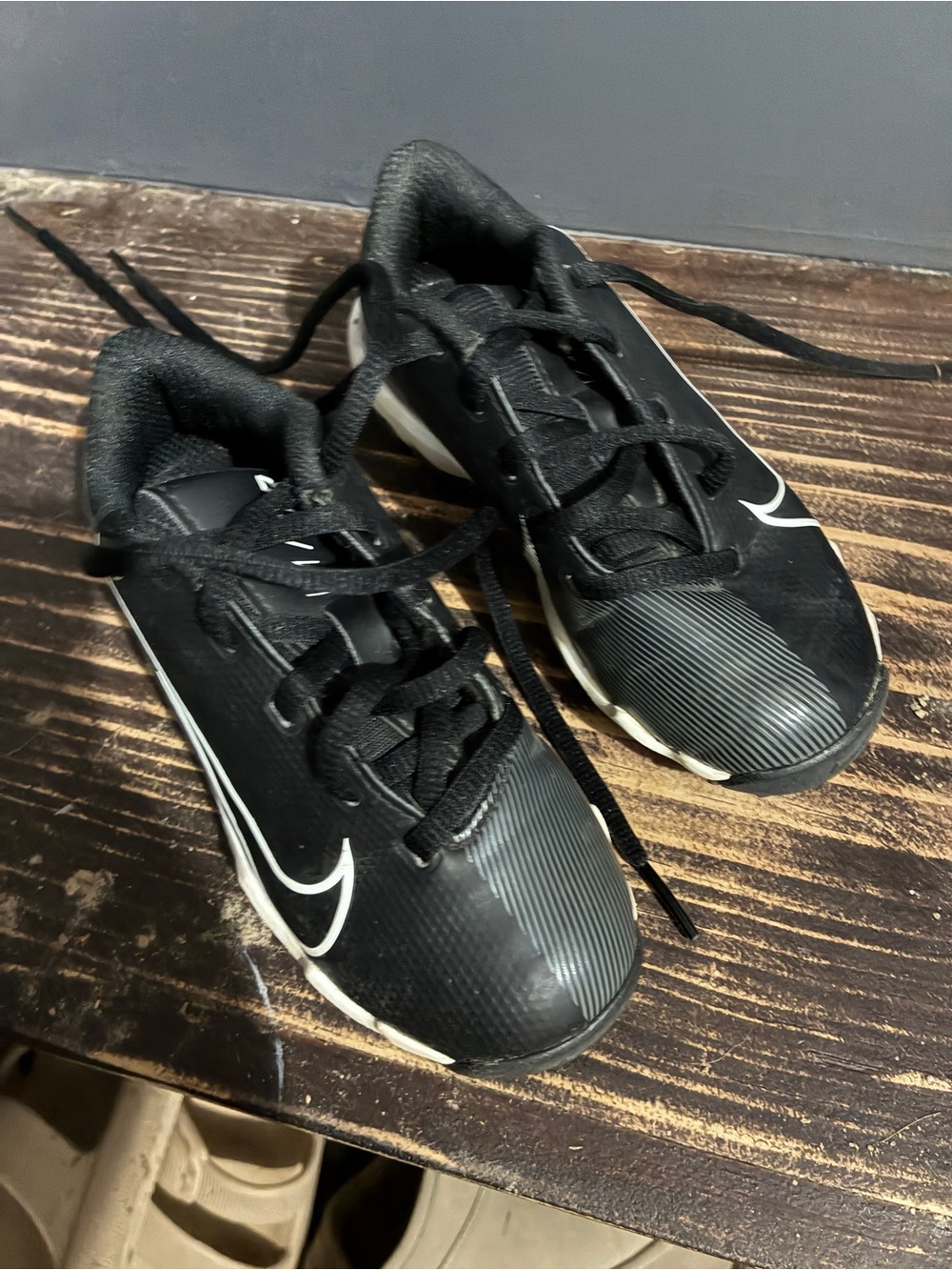 Nike Black and White Baseball Cleats with Bold Swoosh